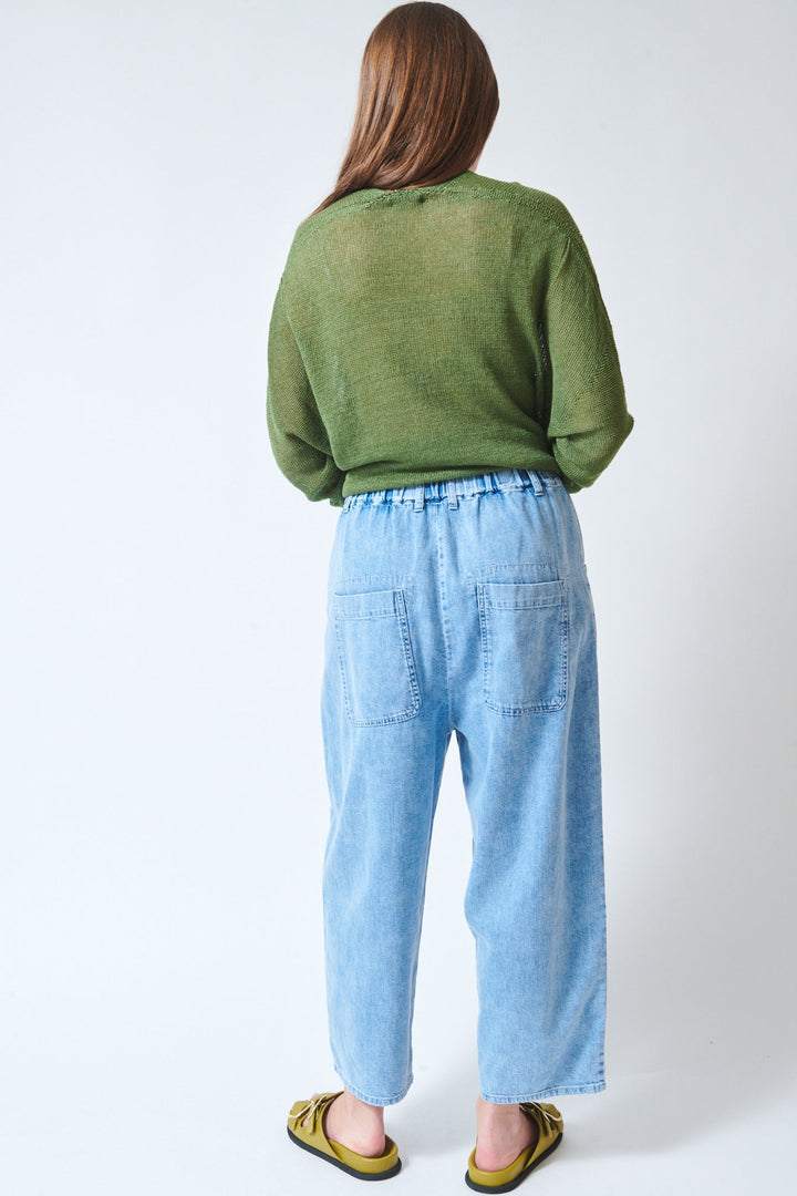 Julia wearing Pas de Calais 8oz Natural Denim Easy Pants Ice Blue rear view
