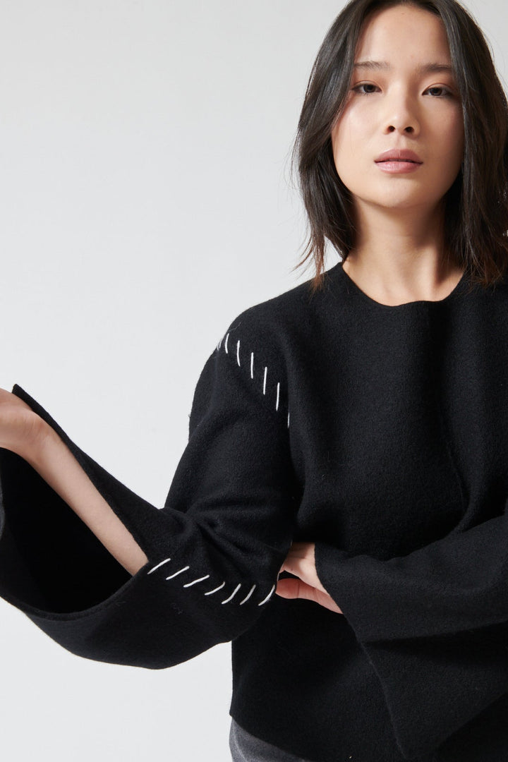 Lilly wearing The Garment Oslo Sweater front view