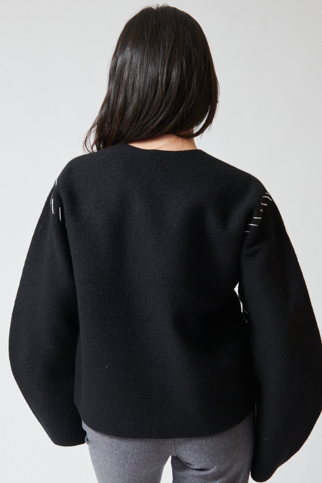 Lilly wearing The Garment Oslo Sweater rear view