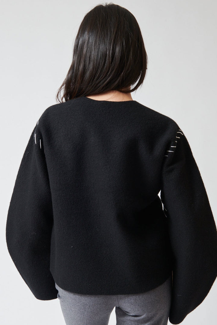 Lilly wearing The Garment Oslo Sweater rear view