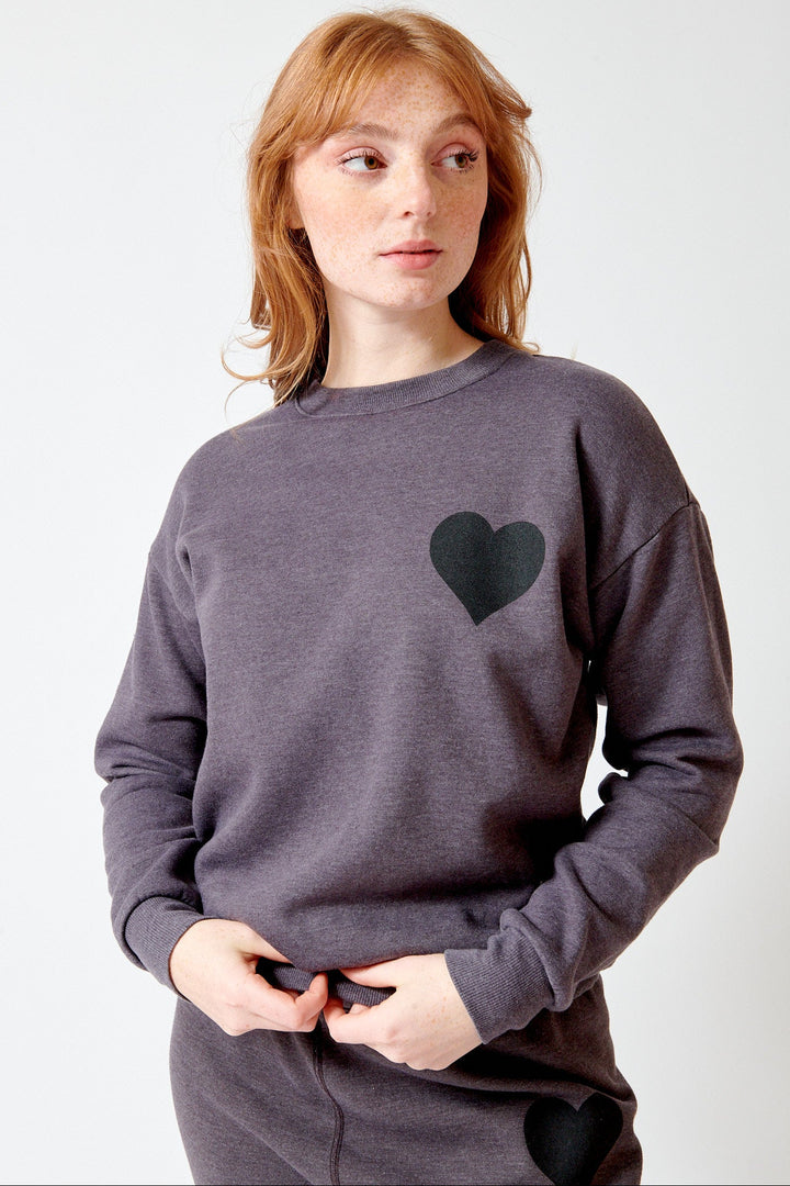Waverly wearing SPRWMN Heart Sweatshirt front view