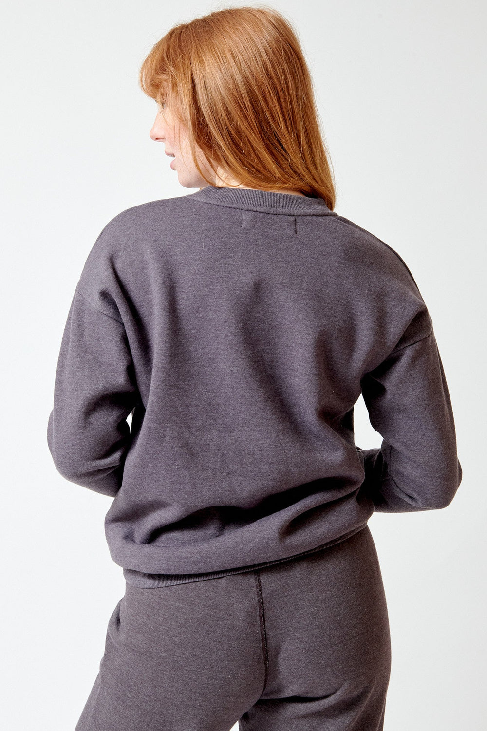 Waverly wearing SPRWMN Heart Sweatshirt rear view