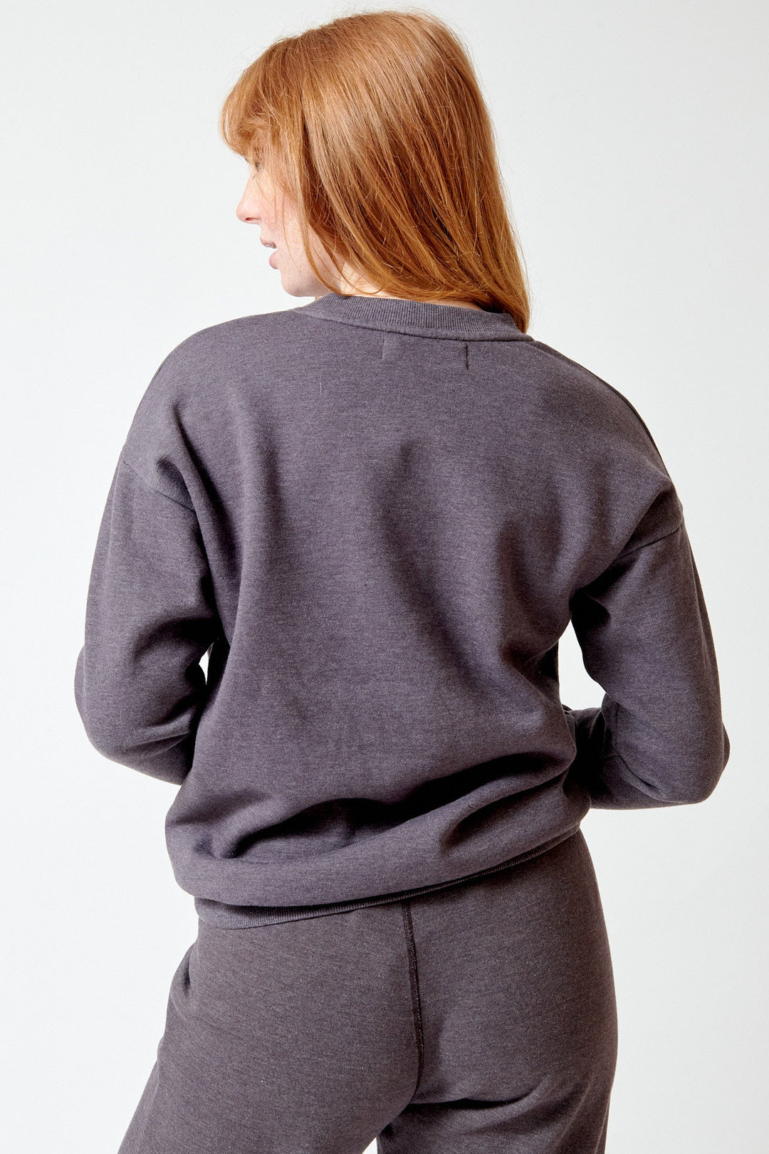 Waverly wearing SPRWMN Heart Sweatshirt rear view