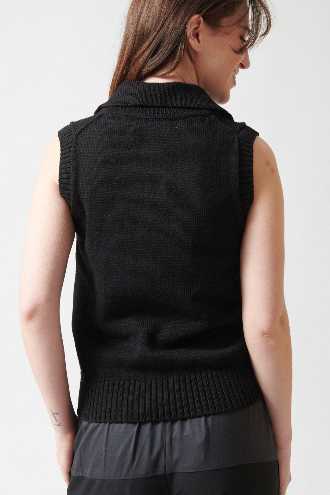 Sophie wearing 6397 Polo Vest rear view