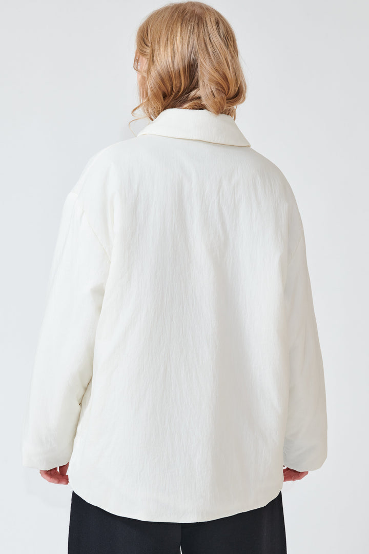 Madi weairng Studio Nicolson Togg Padded Overshirt Jacket rear view