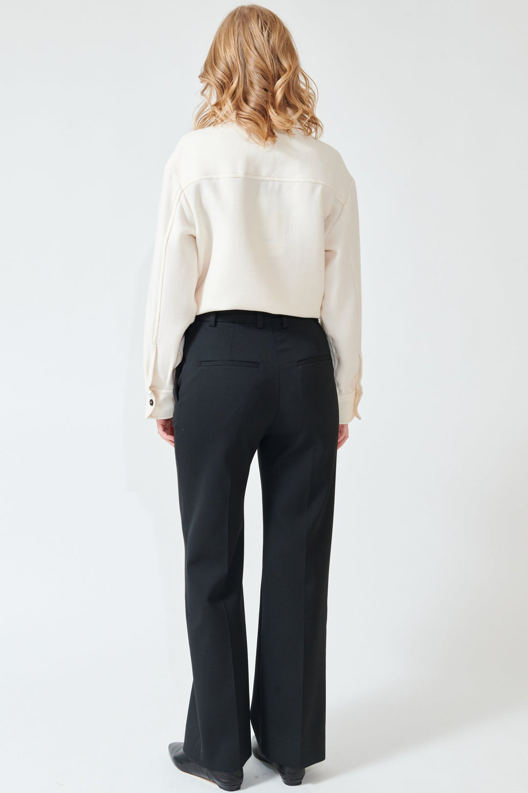 Madi wearing Studio Nicolson Holm Straight Leg Pant rear view