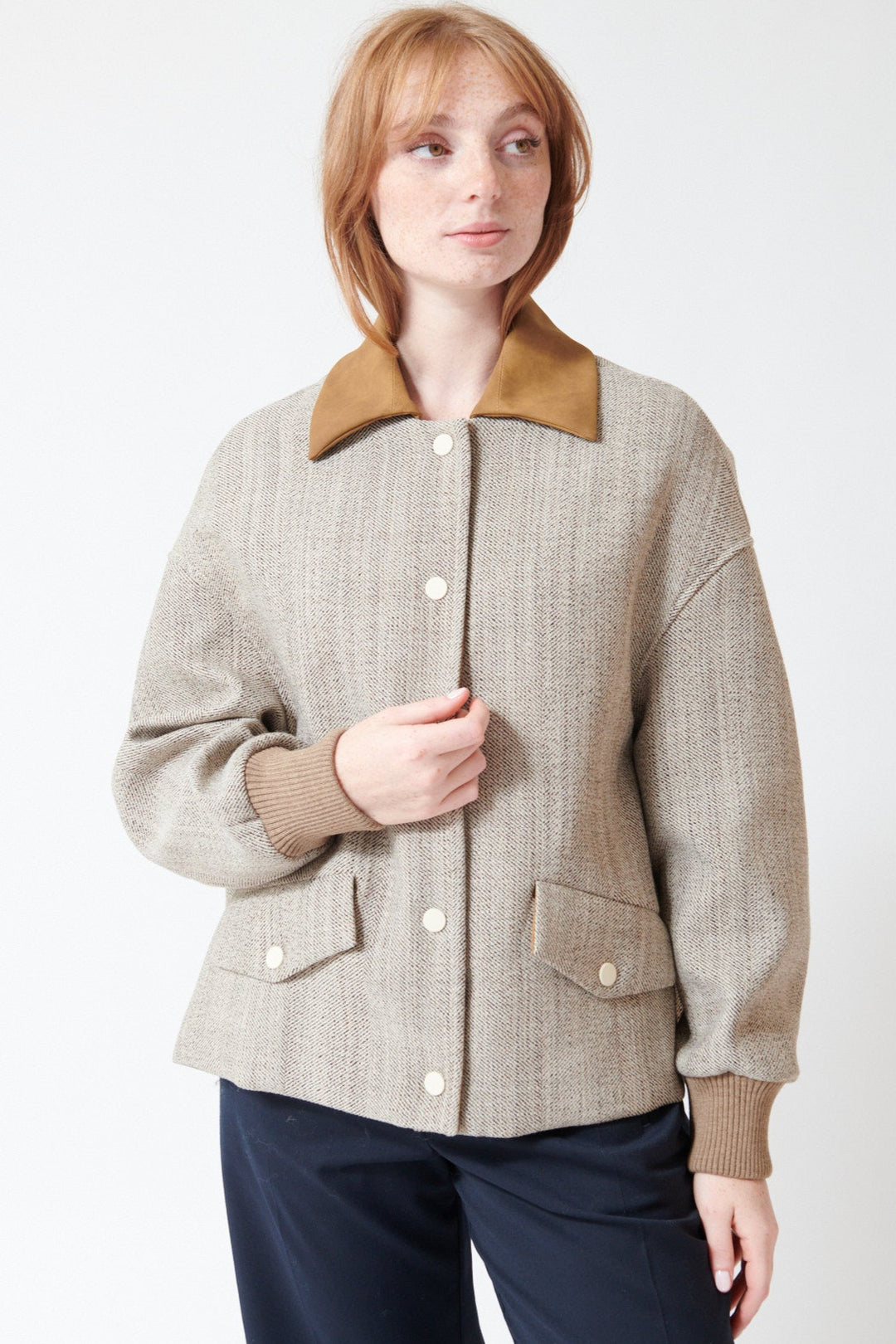 Waverly wearing Tela Bubble Spin in Natural, front view.