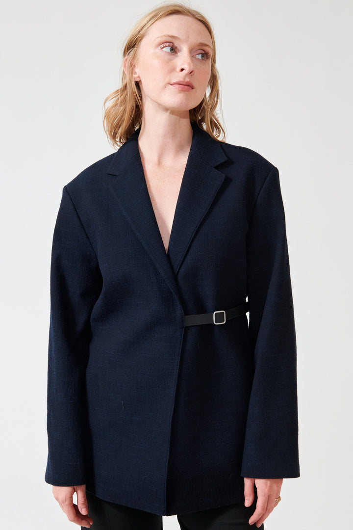 Madi wearing Studio Nicolson Silas Rounded Tailored Jacket front view