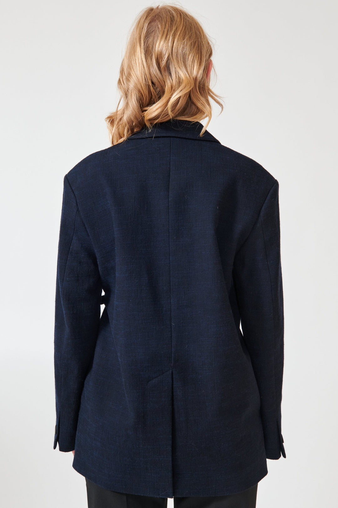 Madi wearing Studio Nicolson Silas Rounded Tailored Jacket rear view
