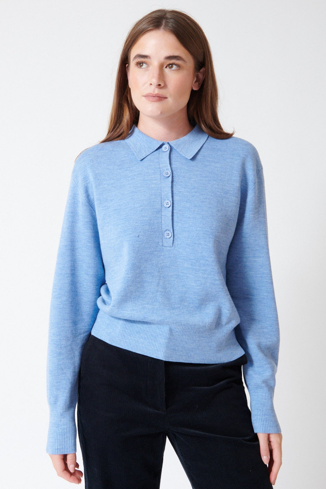 Julia wearing Apiece Apart Kari Polo Knit in Heathered Sky, front view.