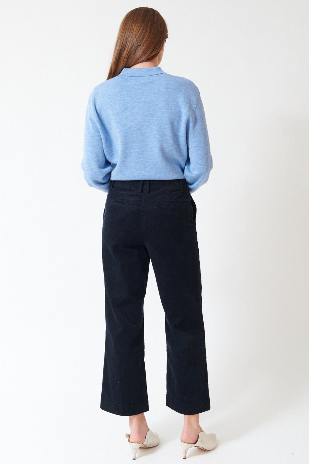 Julia wearing Apiece Apart Sadie Trouser in Midnight, rear view.