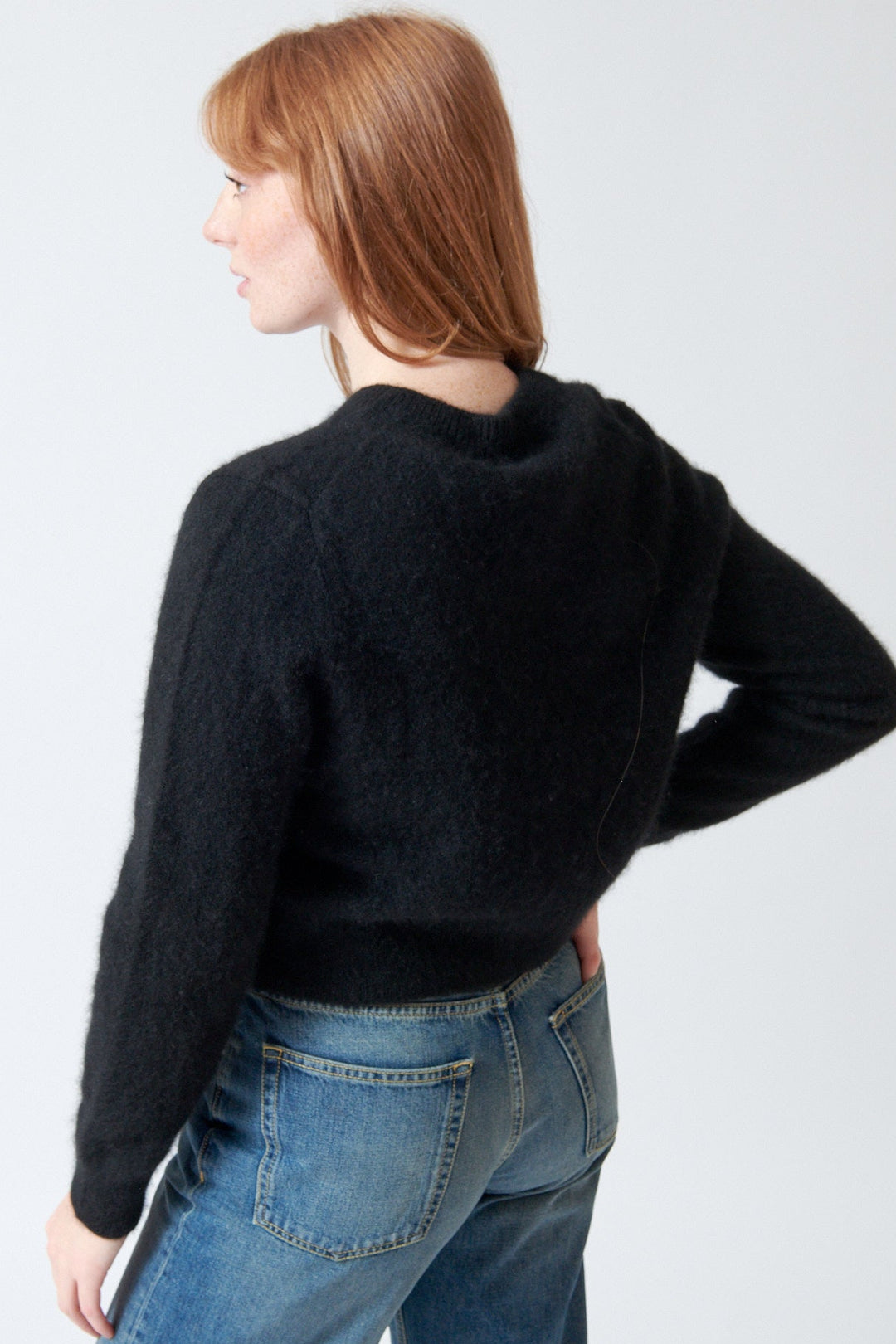Waverly wearing White + Warren Brushed Cashmere Crewneck Cardigan rear view