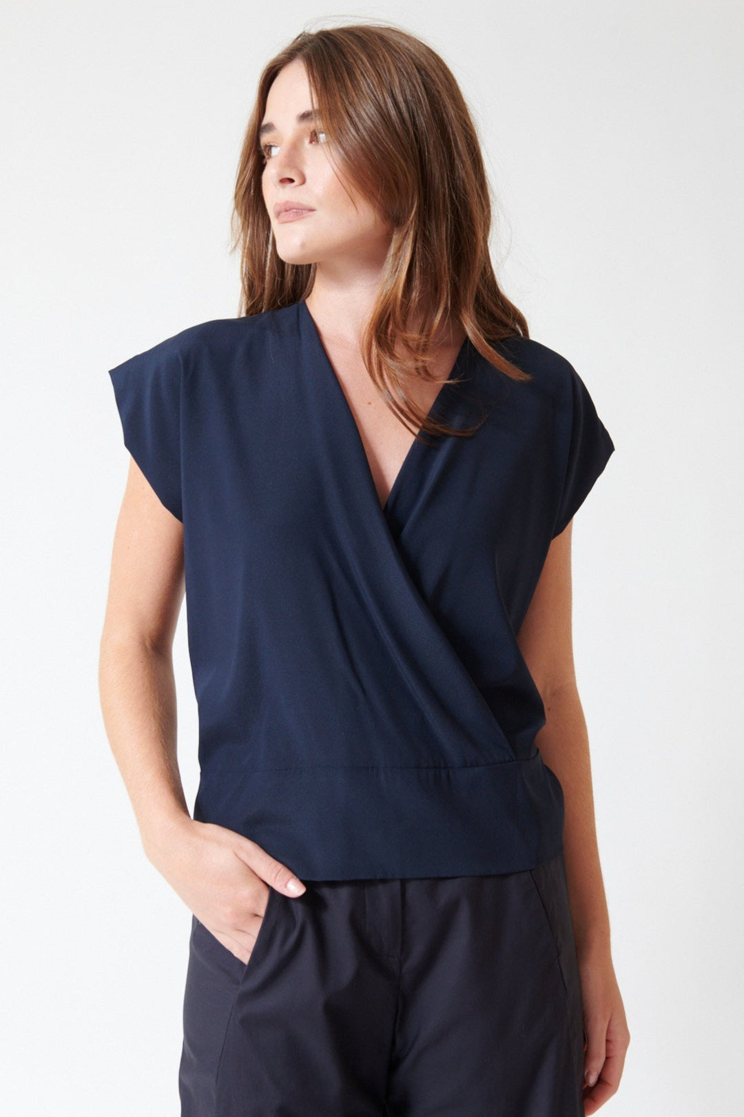 Julia wearing Zero + Maria Cornejo Silk Charmeuse Wrap Mido Top in Ink Jet, front view.