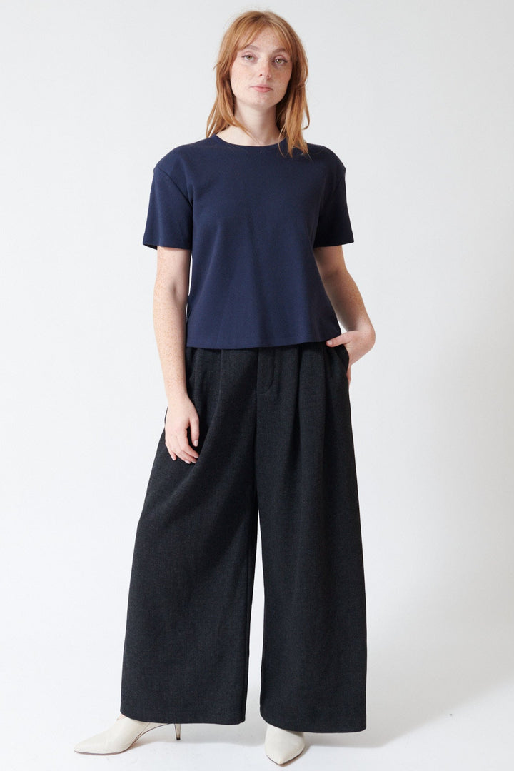 Waverly wearing ELEH Modern Muldoon Trouser in Charcoal, front view.