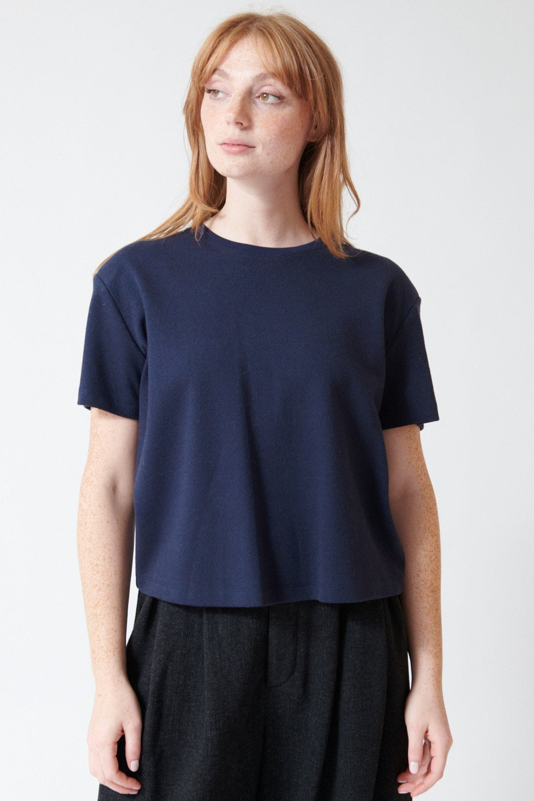 Waverly wearing ELEH Ella Cotton Blend Short Tee With Shoulder Pads in Blue Night, front view.