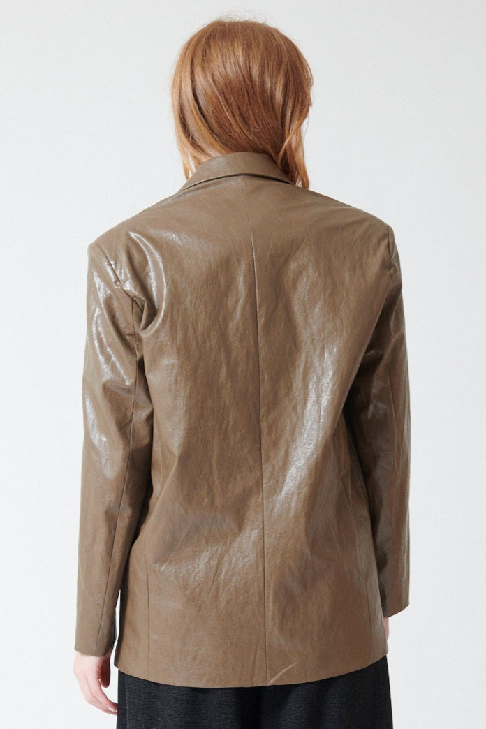 Waverly wearing ELEH Polly Esther Leather Look Blazer in Taupe, rear view.