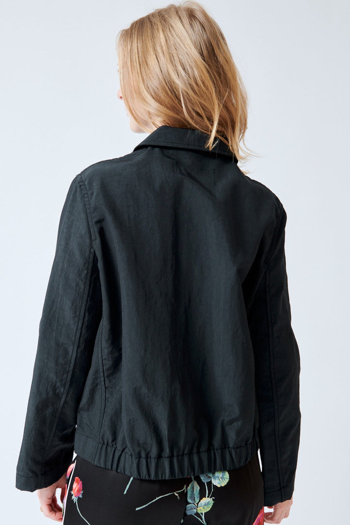 Madi wearing Christian Wijnants Jelina Recycled Nylon Zip Jacket rear view