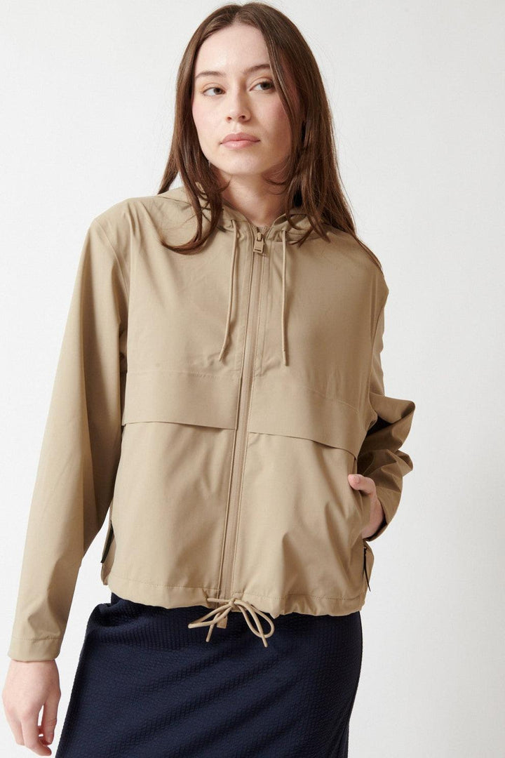 Angela wearing Rains Suva Hardshell Short String W Jacket W3 front view