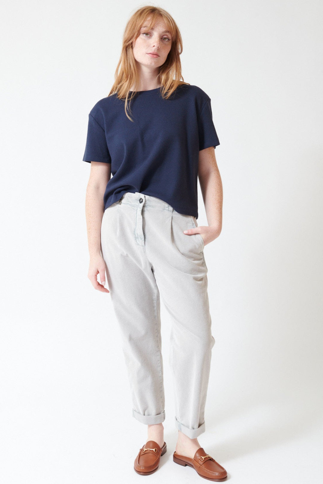 Waverly wearing Peserico Stretch Cotton Ready To Dye Corduroy Pants in Stone Grey, front view.