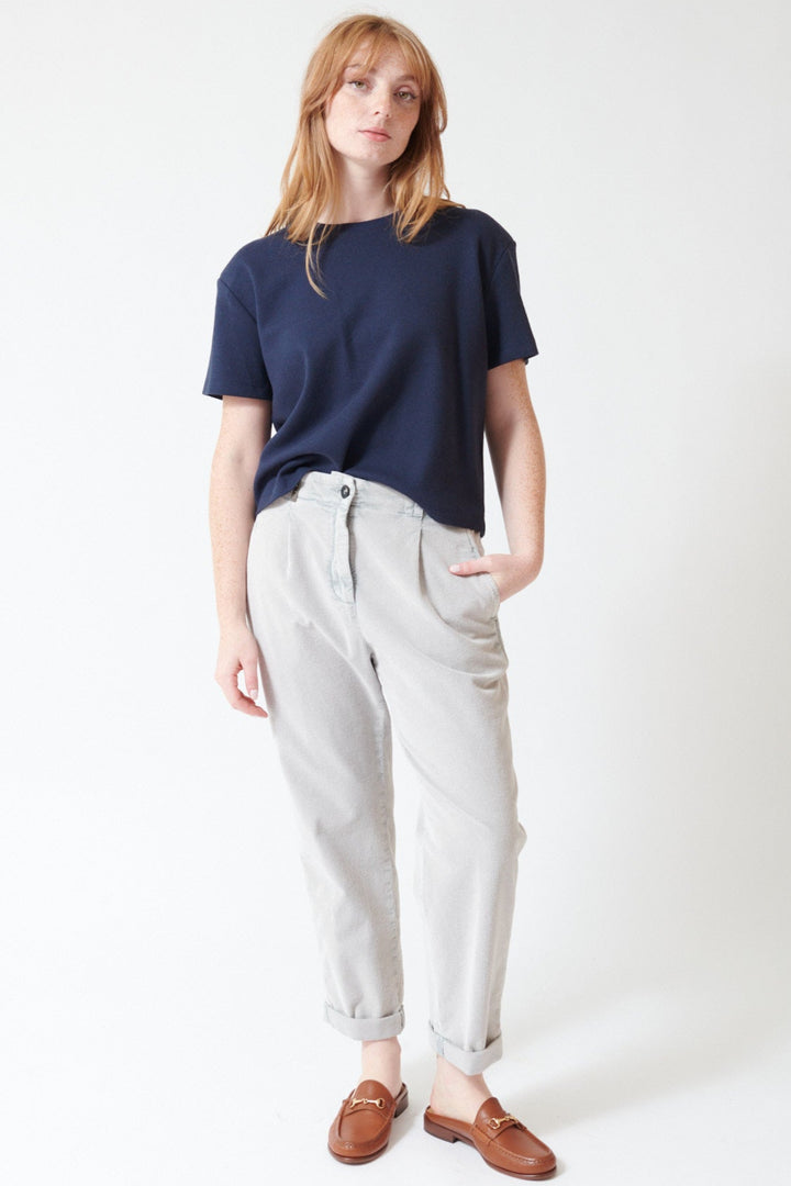 Waverly wearing Peserico Stretch Cotton Ready To Dye Corduroy Pants in Stone Grey, front view.