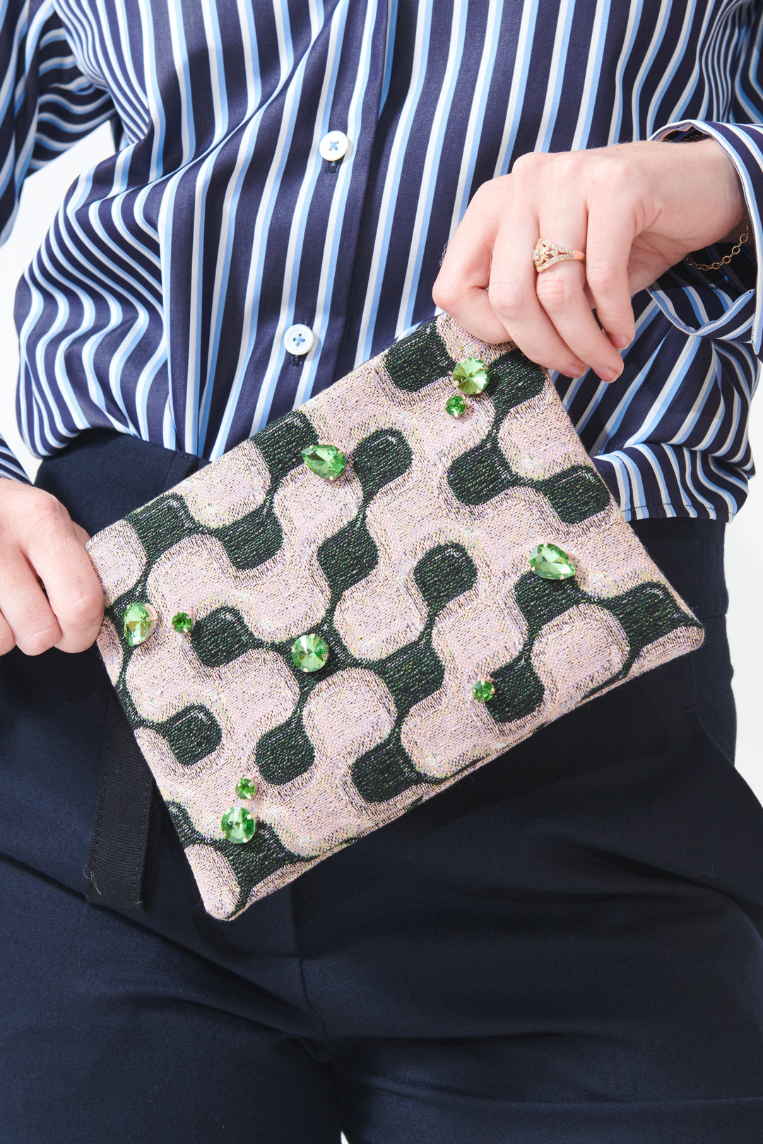 Madi holding Odeeh Lava Flow Wristlet front view