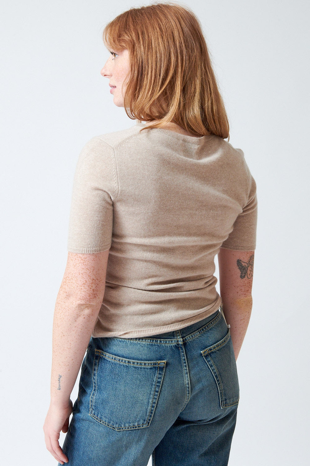 Waverly wearing Allude Cashmere Half Sleeve Sweater rear view