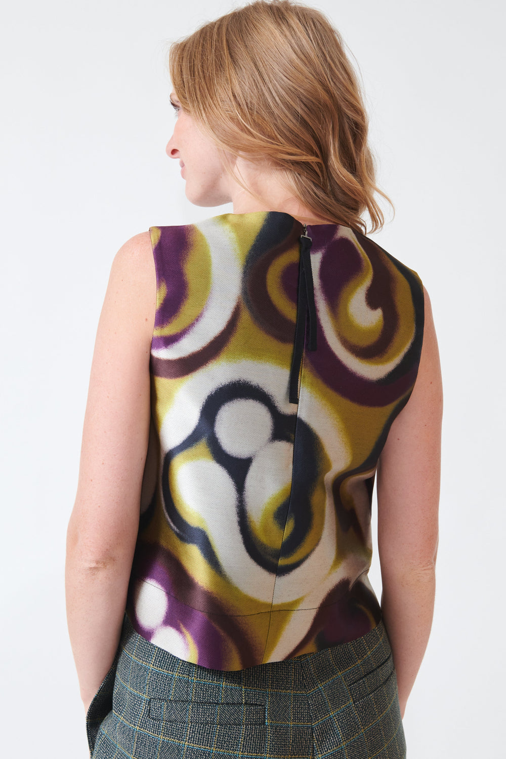 Madi wearing Odeeh Shiny Serge Blurred Paisley Shell Top rear view