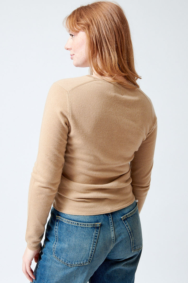 Waverly wearing Allude Cashmere Long Sleeve V Sweater rear view