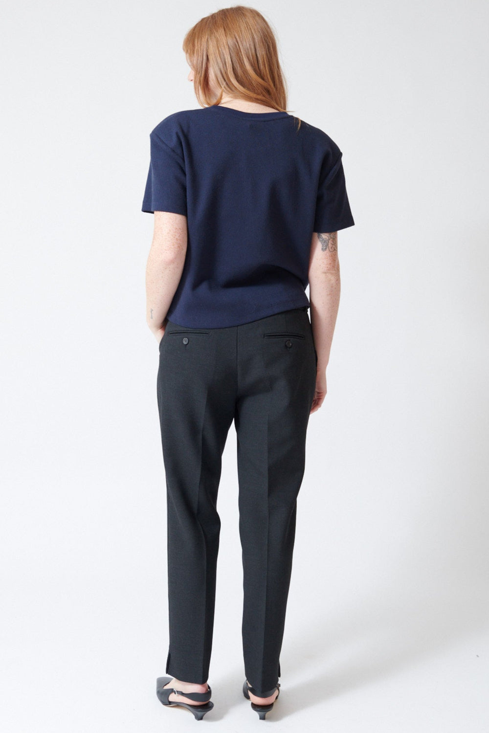 Waverly wearing Peserico Bistretch Compact Double Technical Canvas Cigarette Pants in Dark Sapphire Grey, rear view.