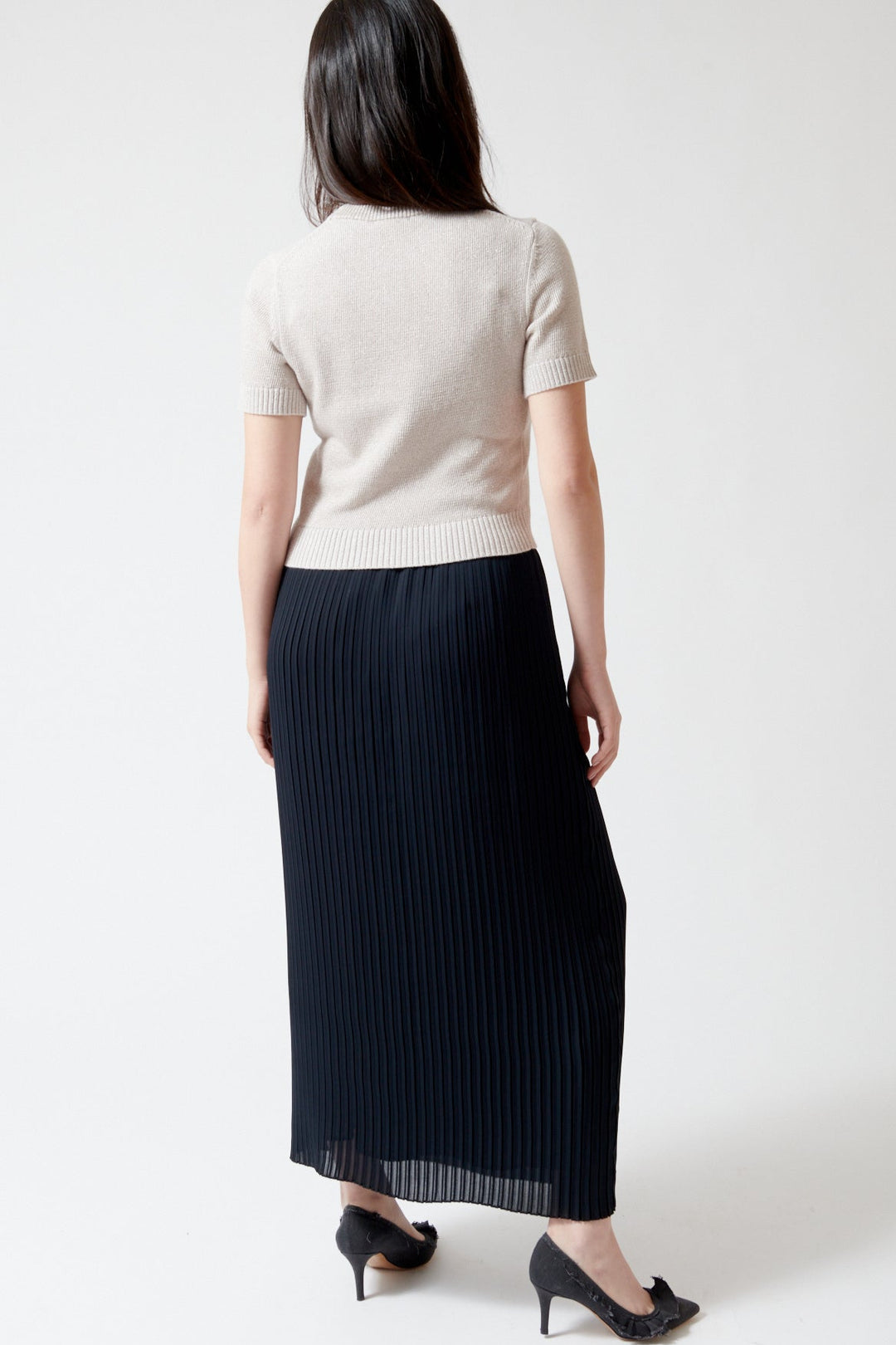 Lilly wearing Lilla P Pleated Maxi Skirt rear view