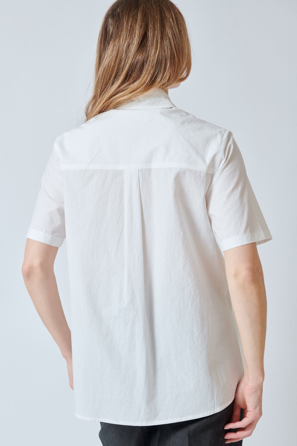 Mari wearing Christian Wijnants Toppo String Detail Short Sleeve Shirt rear view