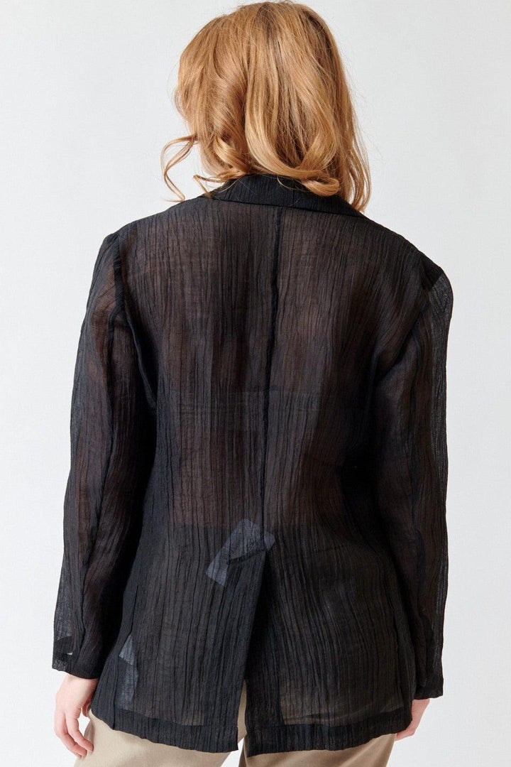 Waverly wearing Seventy Sheer Warm Weather Travel Blazer rear view