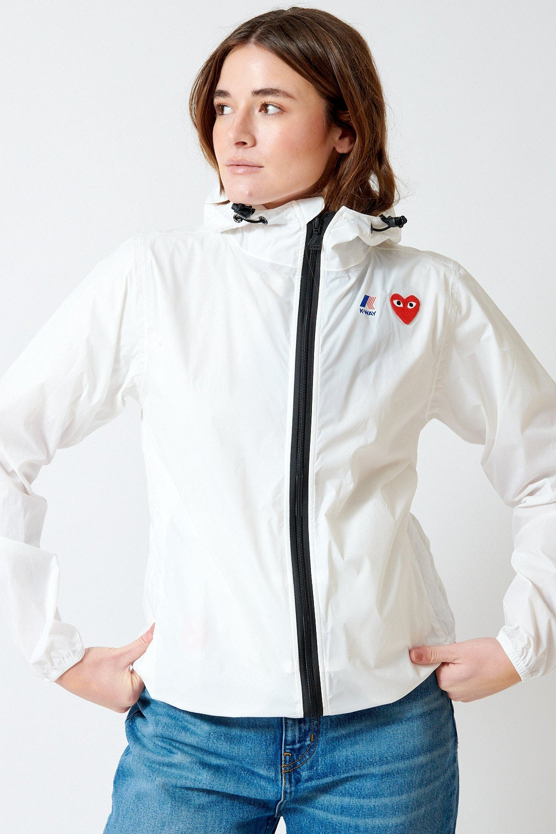 Julia wearing Comme des Garçons PLAY K-Way Full Zip Red Emblem Jacket front view