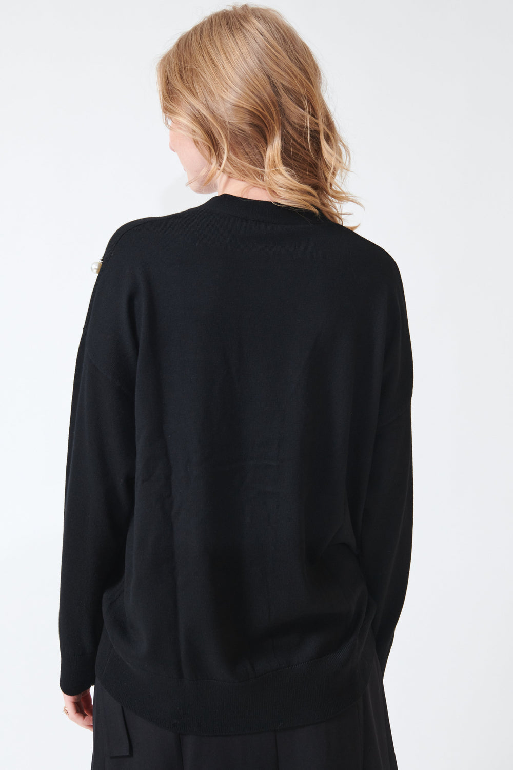 Maddie wearing Meimeij Pearl Bobbles Merino Wool Cardigan rear view
