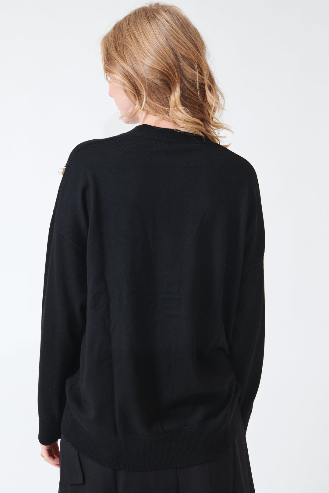 Maddie wearing Meimeij Pearl Bobbles Merino Wool Cardigan rear view