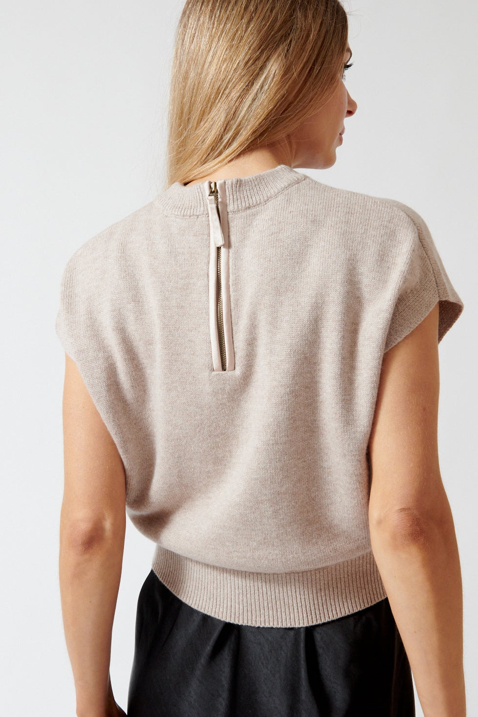 Mari wearing Lilla P Banded Bottom Wedge Sweater rear view