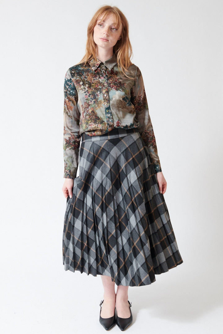 Waverly wearing Peserico Viscose Blend Flannel Check Plisse Skirt in Dark Sapphire Grey, rear view.