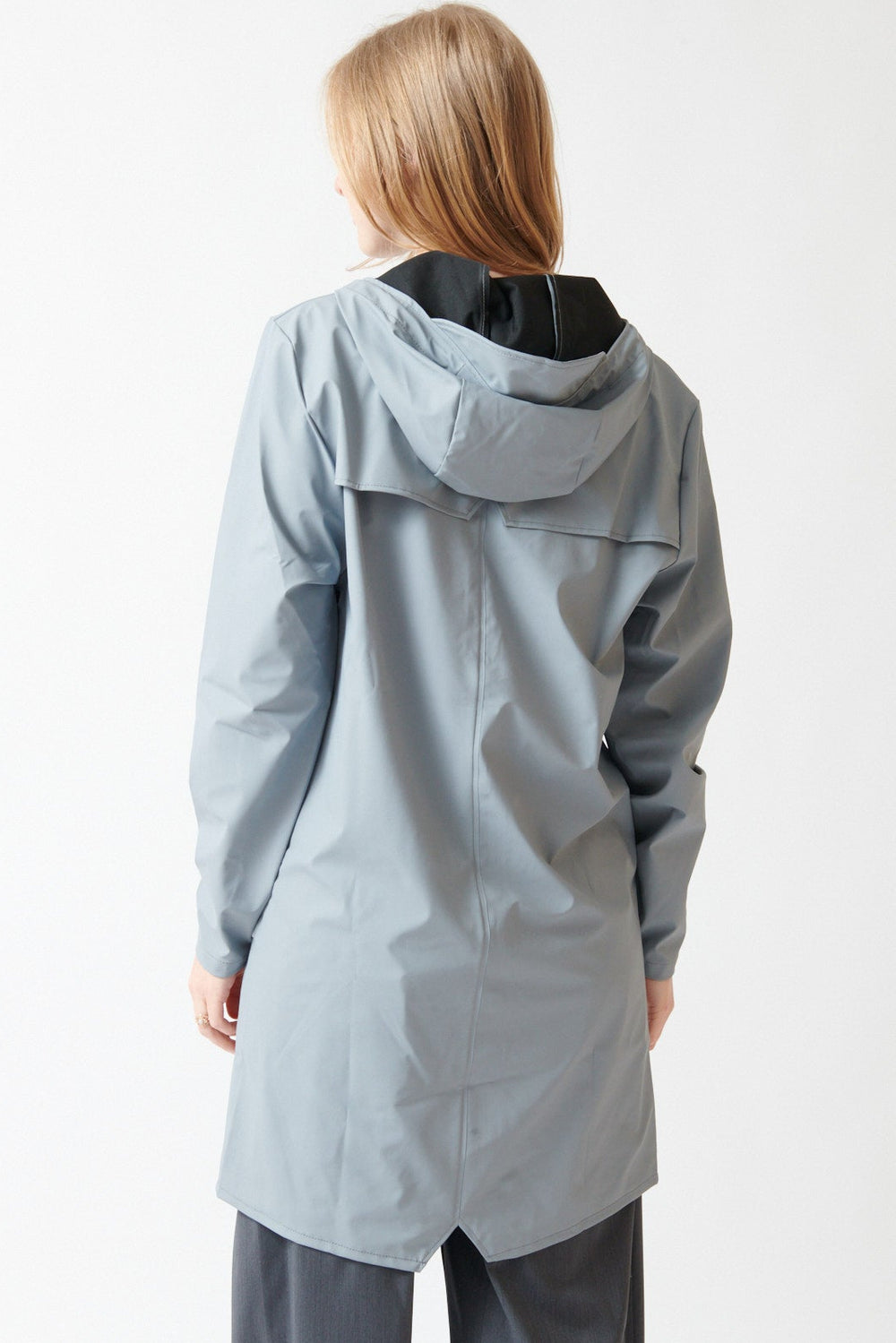 Madi wearing Rains Long Jacket W3 rear view