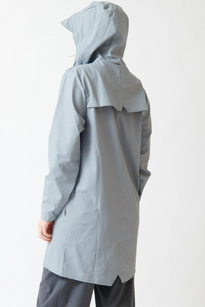 Madi wearing Rains Long Jacket W3 rear view
