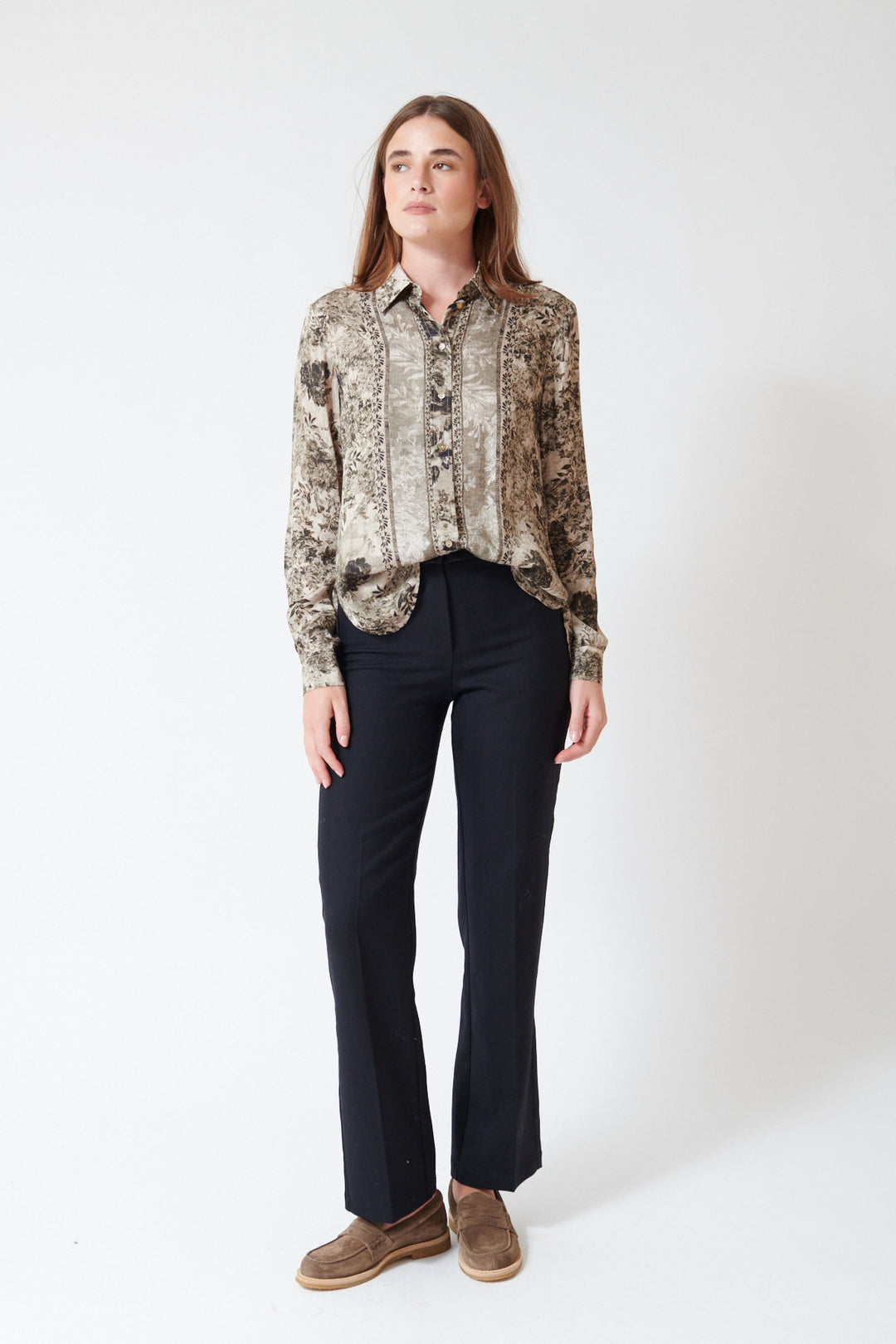 Julia wearing Momoni Benjamin Tuxedo Pant in Black with a French truck, front view.