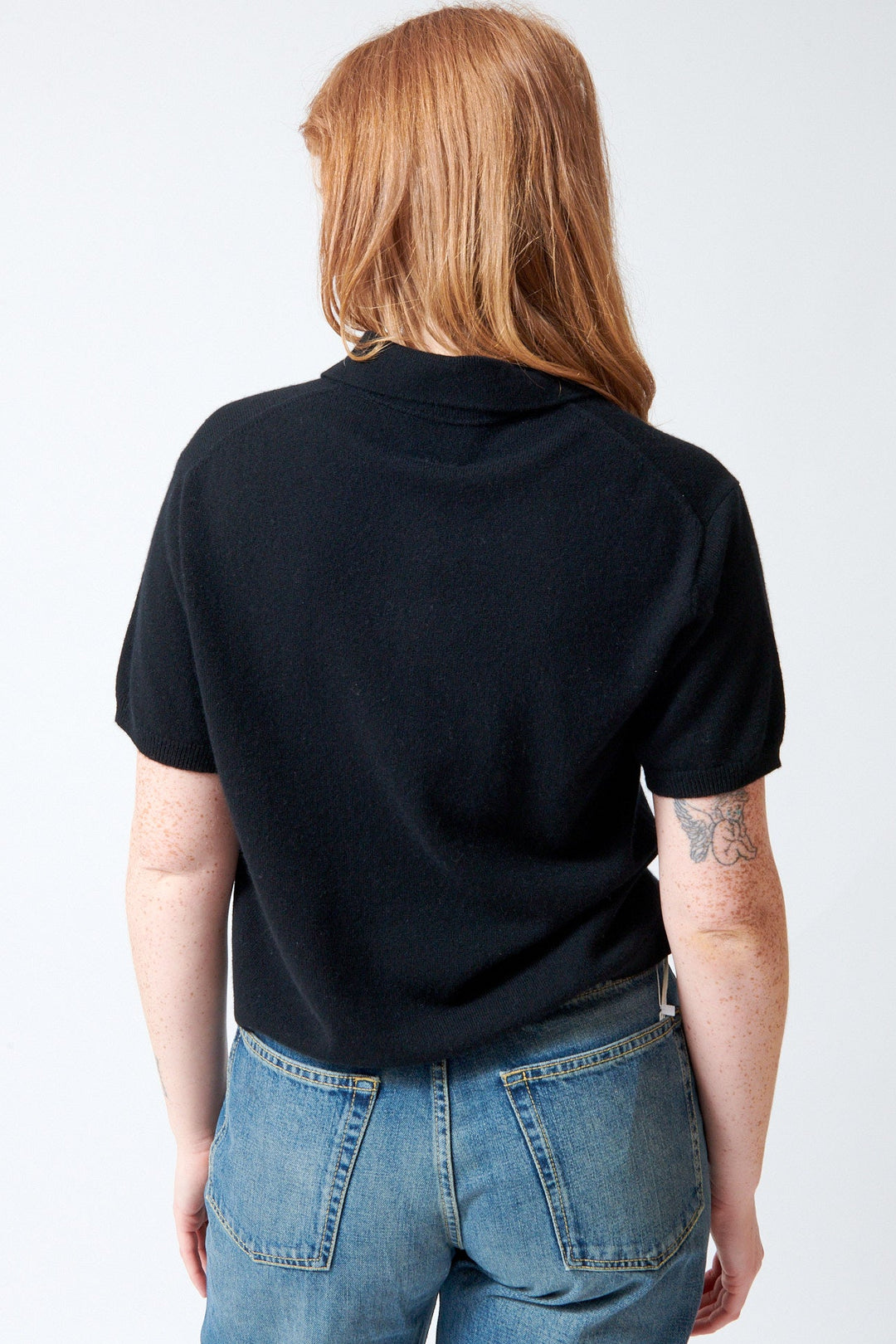 Waverly wearing Allude Cashmere Quarter Sleeve Polo Neck Sweater rear view