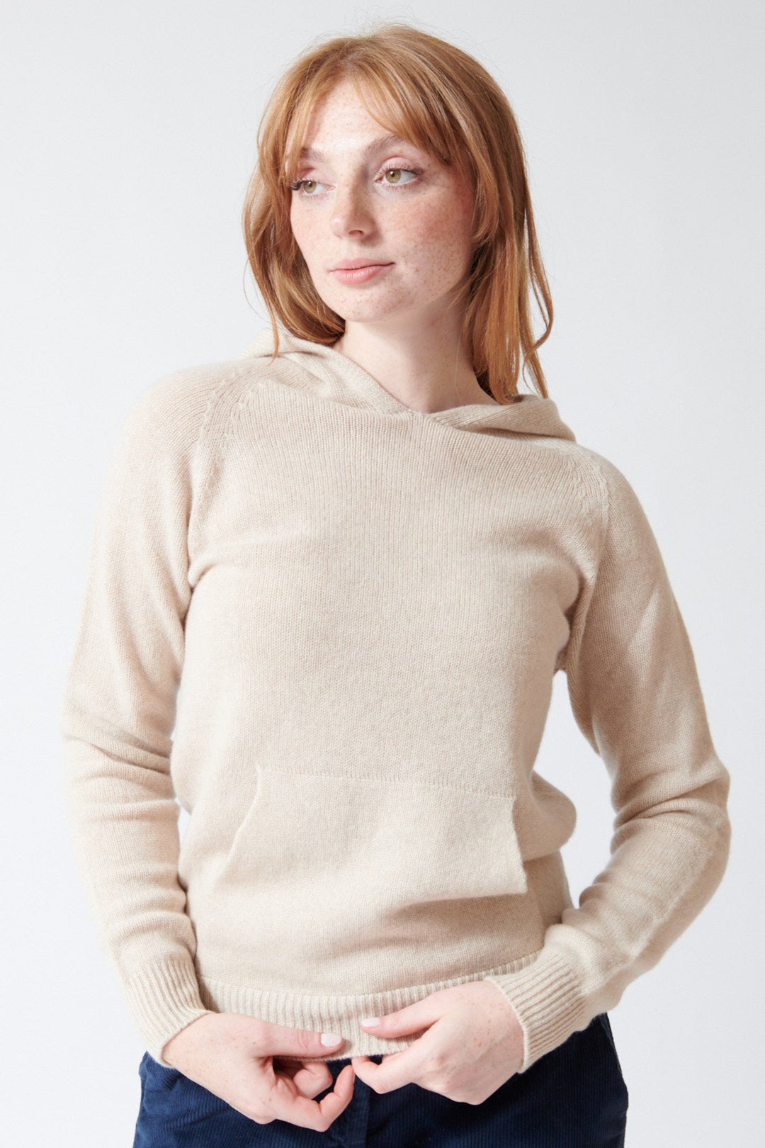 Waverly wearing Rosso 35 Wool Cashmere Hooded Pullover in Light Oat, front view.