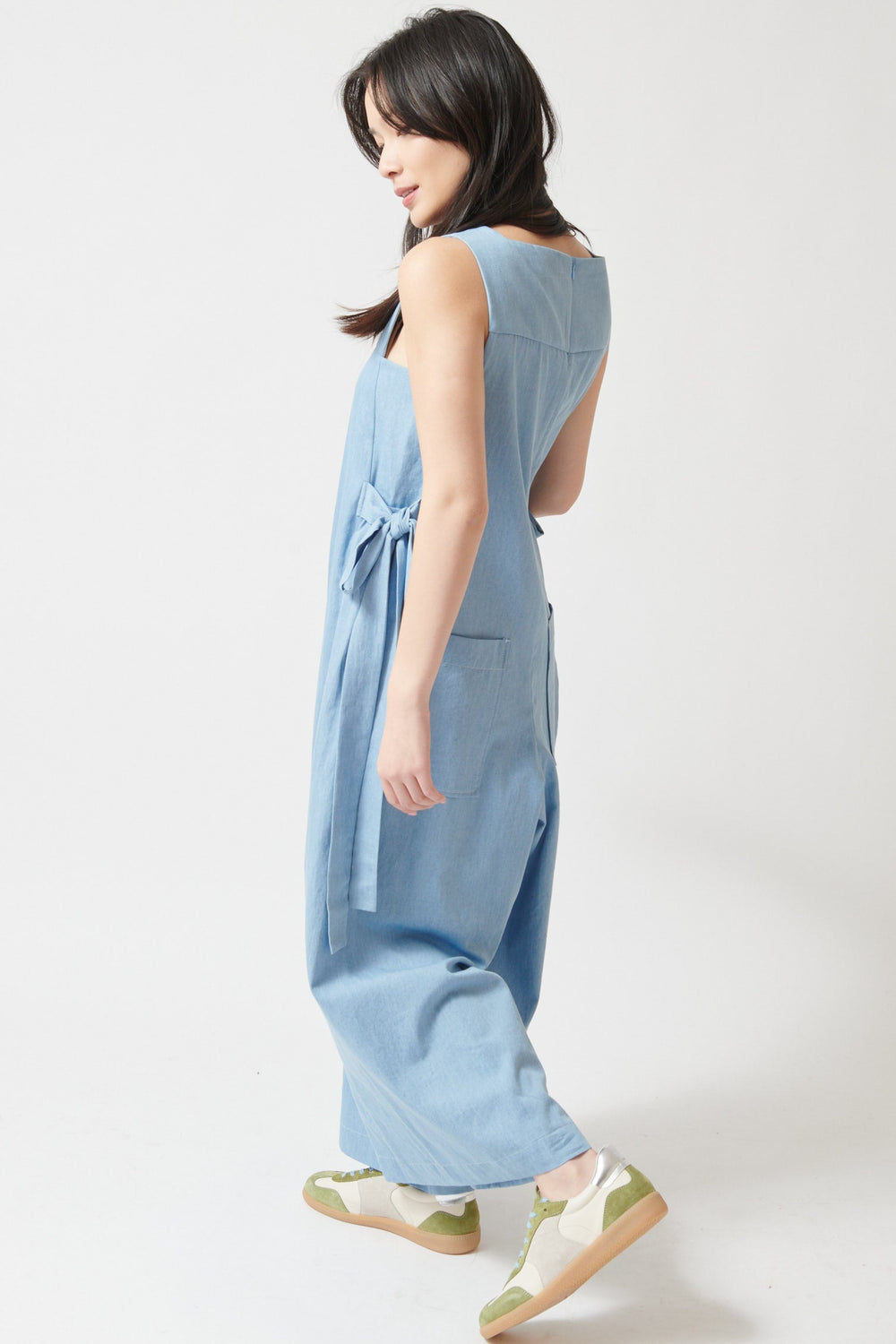 Lilly wearing Meimeij Side Tie Wide Leg Overalls With Pockets side/rear view
