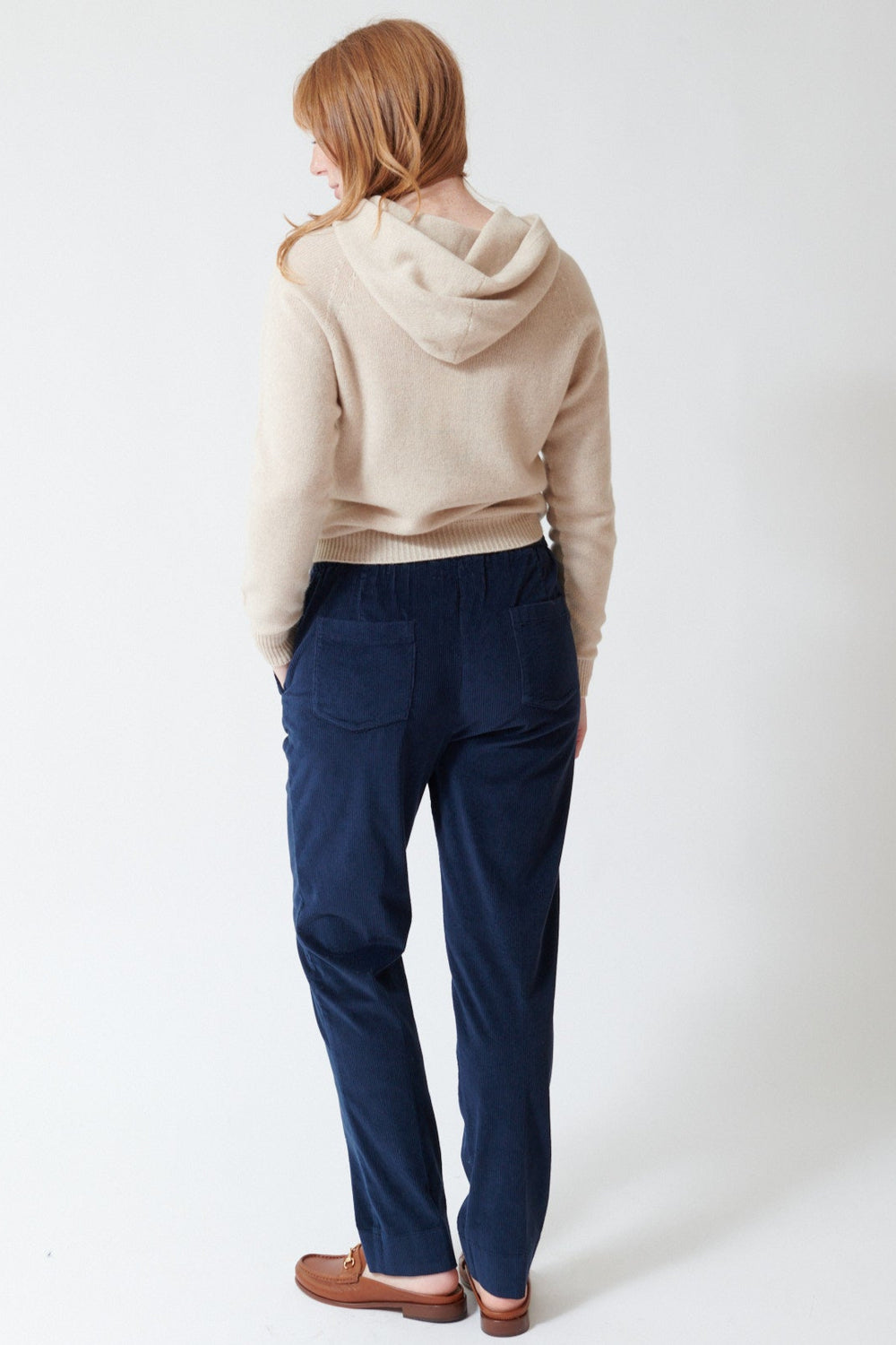Waverly wearing Rosso 35 Stretch Back Corduroy Pant in Blue, rear view.