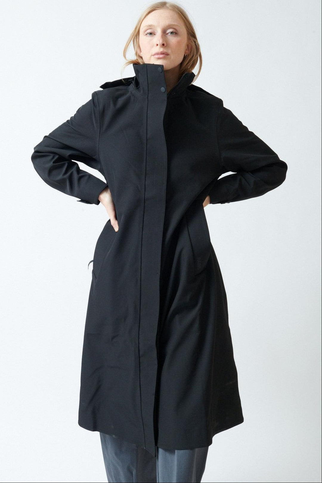 Madi wearing Rains Suva Vision Softshell A-Line W Jacket front view