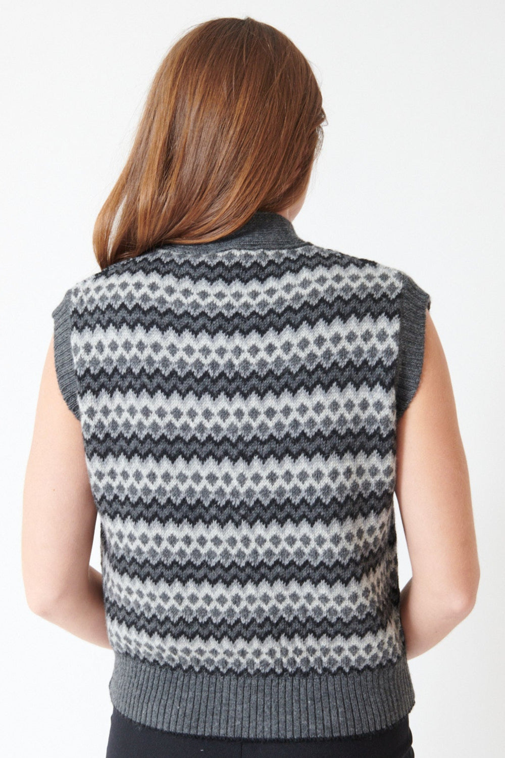 Julia wearing Momoni Thyme Knitwear Vest in Grey Multicolor, rear view.