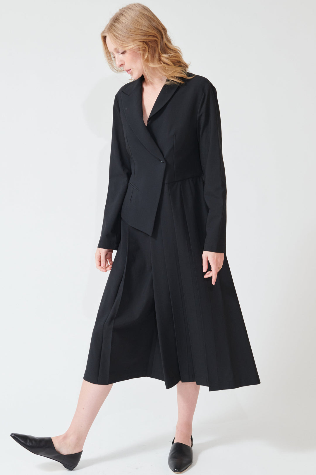 Maddie wearing Meimeij Half Blazer Pleat Dress front view