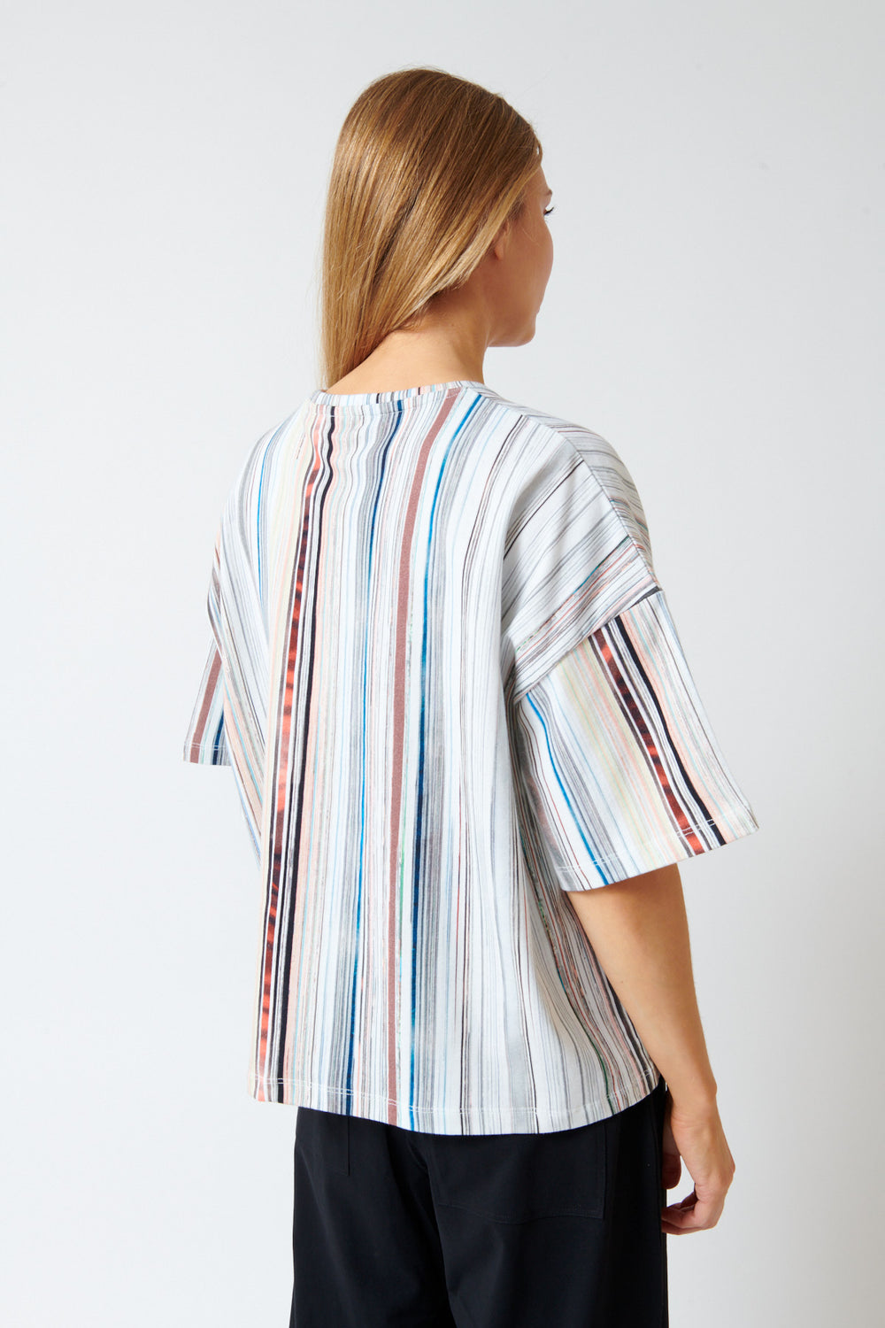 Mari wearing Kowtow Library Tee rear view