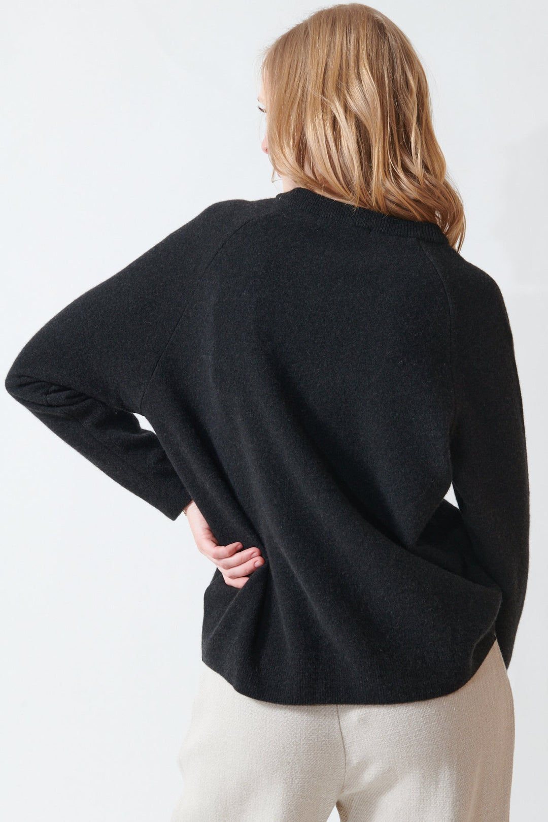 Madi wearing Evam Eva Press Wool Raglan Pullover rear view