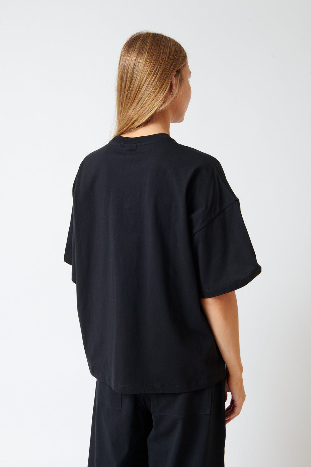 Mari wearing Kowtow Monochrome Tee rear view